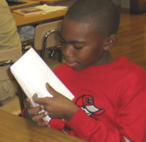 student with brochure