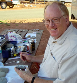Larry painting rocks